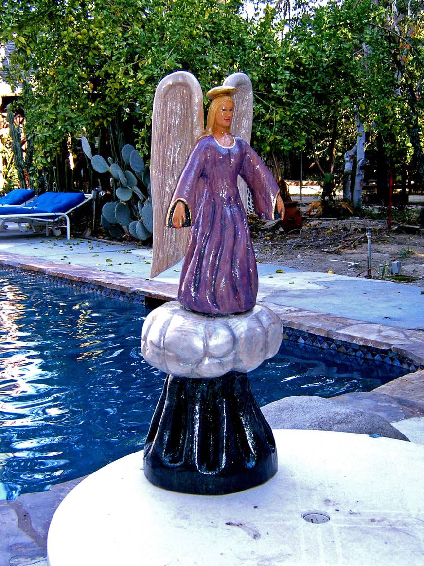 Wood carving of an angel, sculpture of an angel, art
