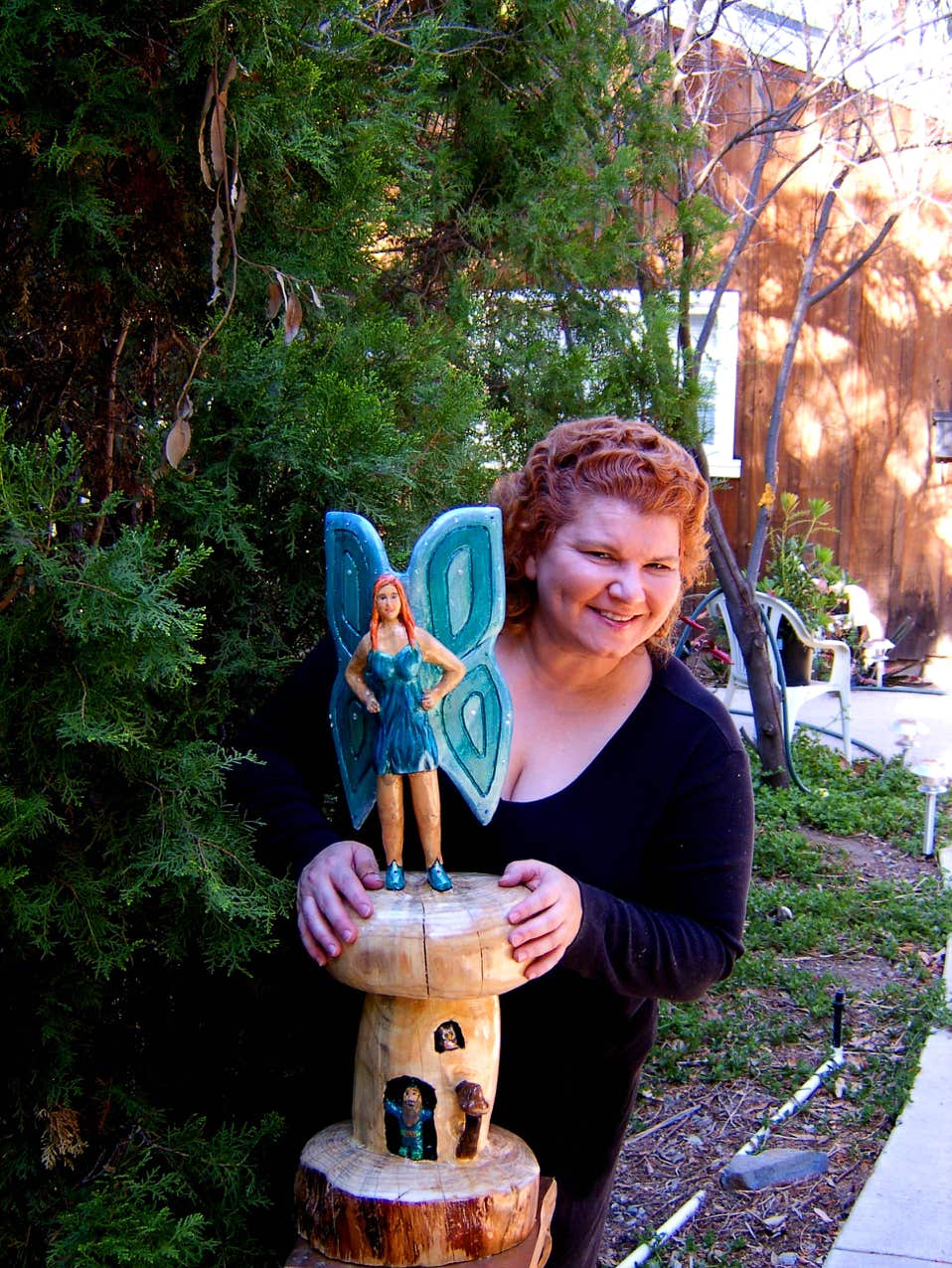 Wood carving of a fairy, sculpture of a fairy, art