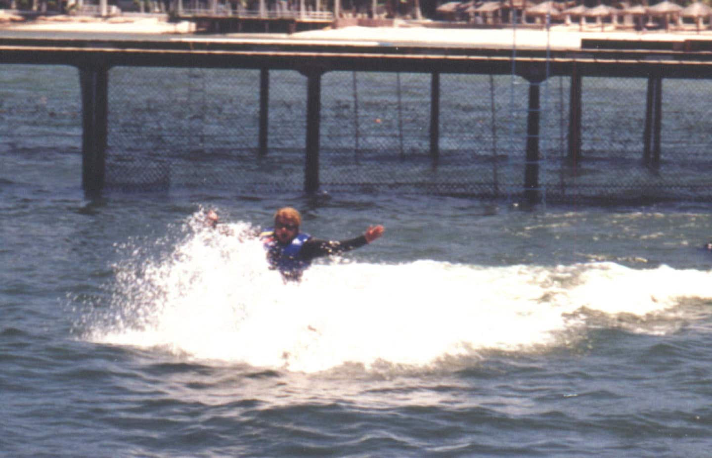 Casey McCaughn swimming with the dolphins