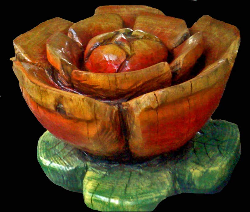 Wood carving of a flower, sculpture of a flower, art