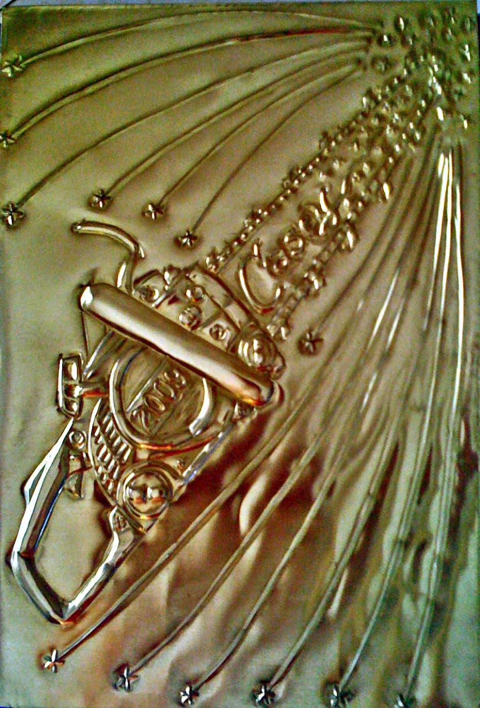 Tooled brass, chainsaw book cover, year of the chainsaw